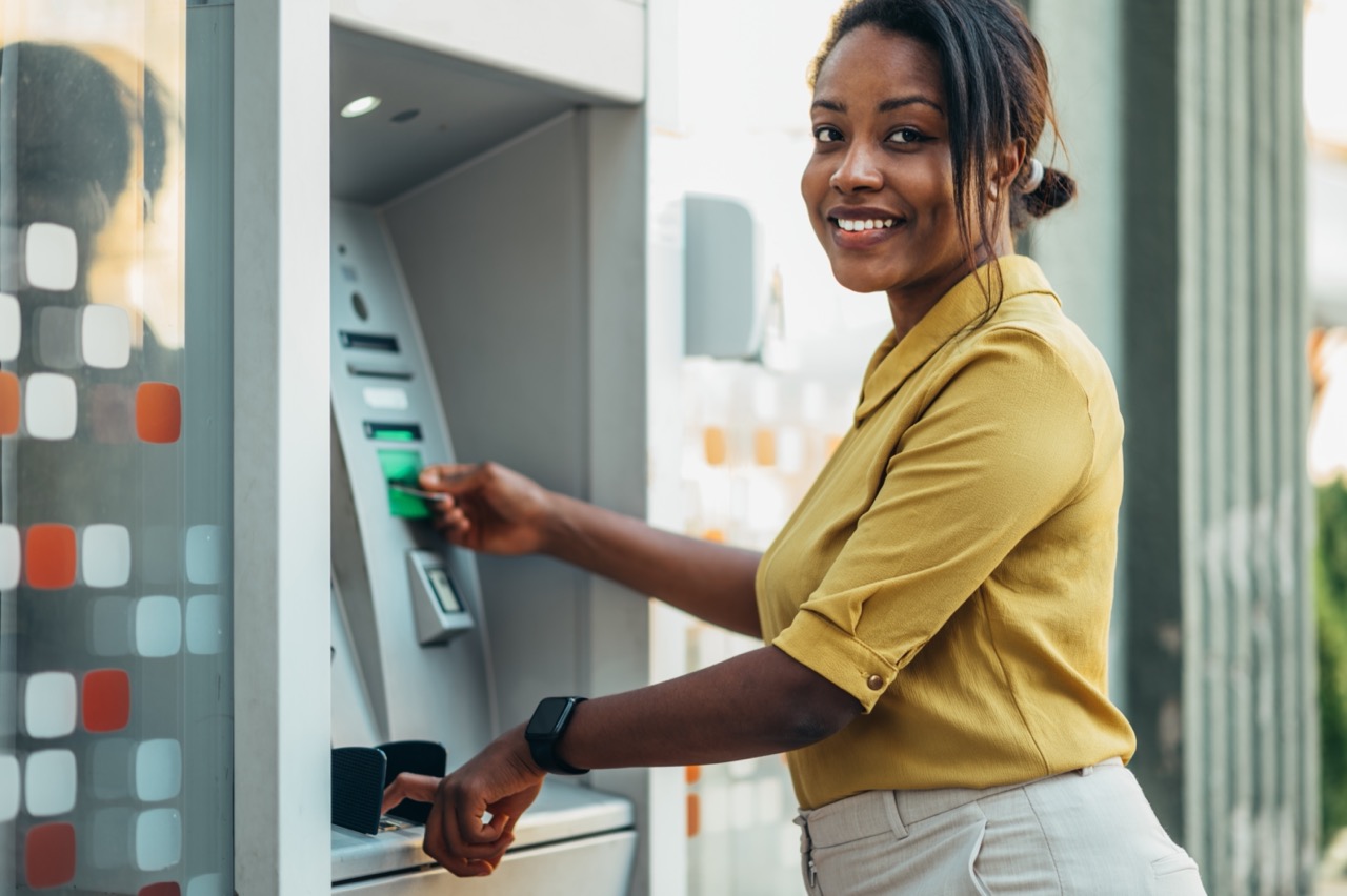 woman-using-outside-atm